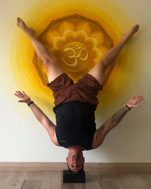 Rob Hanrieder doing a hands-free headstand Rob Hanrieder, your wellness coach, doing a hands-free headstand